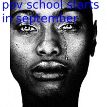 a black and white photo of a man 's face with a tear running down his eye .