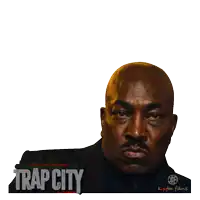 a poster for trap city shows a bald man