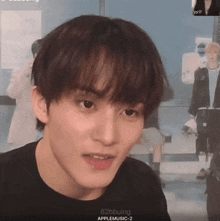 a close up of a person 's face with 82bbuing applemusic-2 on the bottom right