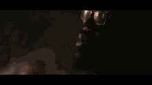 a blurred image of a person 's feet in a dark room