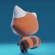 a stuffed animal with a striped tail is looking at the camera
