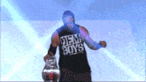 a man wearing a shirt that says den boys