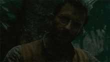 a man wearing glasses and a vest says survival is a long shot