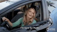 a woman in a car says i 'm here for pucks showtime