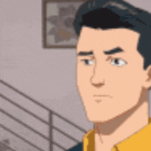 a man in a yellow shirt is standing in front of a railing and looking at the camera .