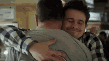 Awk Hug GIF - Jason Ritter Kevin Finn Hug GIFs