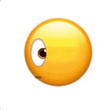 a close up of a yellow smiley face with a white eye and nose .