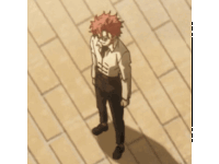 a man with red hair is standing on a wooden floor and covering his face with his hand .