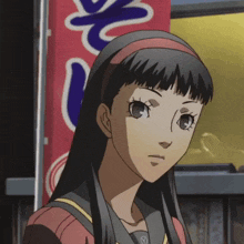 a girl stands in front of a red and blue sign that says ' s ' on it