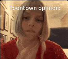a woman in a red shirt with the words toontown opinion on her face