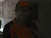 a man wearing a hat and a shirt that says dell