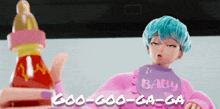 a girl with blue hair is wearing a bib that says baby on it