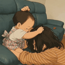 a woman laying on a couch with a baby on her lap touching her hair
