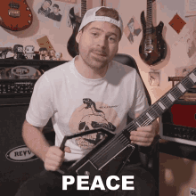 a man holding a guitar with the word peace written on the bottom