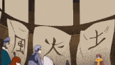 a group of people are gathered in front of a banner with chinese characters