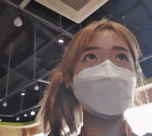 a woman wearing a mask that says n95 on the front