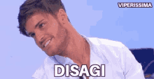 a man with a beard is smiling and the word disagi is on his chest