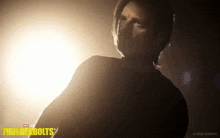 a man in a dark room with the words thunderbolts written on the bottom