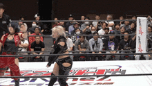 a woman in a ring with a banner that says fame star