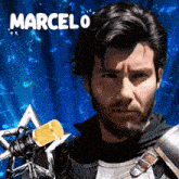 a man with a beard is holding a microphone and the name marcelo is on the bottom