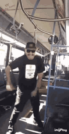 a man is dancing on a bus with the words boop betty on the bottom right