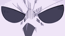 a close up of a person 's face with a very angry expression on it .