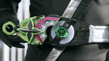 a person is wearing a belt with a green and purple item on it that says ' samurai ' on it