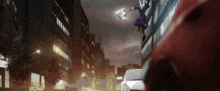 a man is flying through the air while holding a piece of paper with the number 21 on it