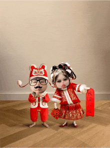 a boy and a girl are standing next to each other and the girl is holding a red sign with chinese writing