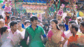 a man and a woman are dancing in a crowd