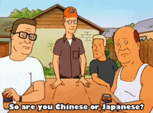 a group of men are sitting around a table with the words so are you chinese or japanese