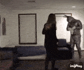 a woman is standing next to a statue of a donkey in a living room with the words imgplay below her