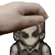 a pixel art of a hand touching a person 's forehead .