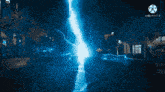 a lightning bolt is coming down the road at night .