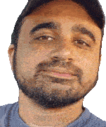 a man with a beard is wearing a blue shirt and a black hat