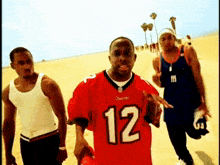 a man in a red jersey with the number 12 on the front