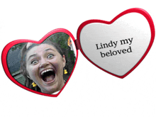 a heart shaped mirror with the words lindy my beloved