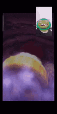 a pixelated image of a person with a frog mask on