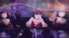a blurred image of a group of people dancing in a club .
