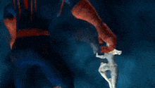 a white object is floating in the air in a dark blue background .