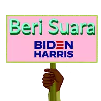 a hand holding a sign that says biden harris on it