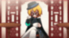 a blurred image of a girl wearing a hat and glasses .
