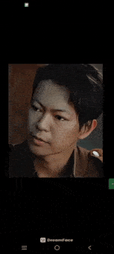 a screenshot of a man 's face with a dreamface app open