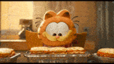 a cartoon character named garfield is sitting at a table eating sandwiches