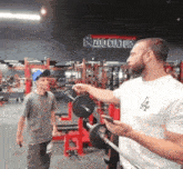 a zoo culture sign can be seen in the background of this gym