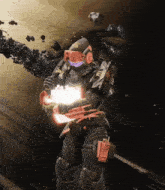 a man in a space suit is holding a glowing object in his hands