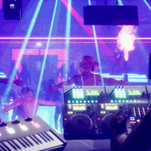 a dj is playing music in a dark room with a keyboard in the foreground