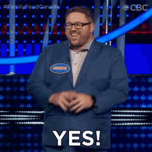 a man in a suit and name tag that says andrew says yes .