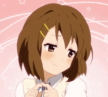 a girl with brown hair and a yellow stripe on her hair