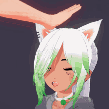 a person 's hand is on the head of a girl with green hair
